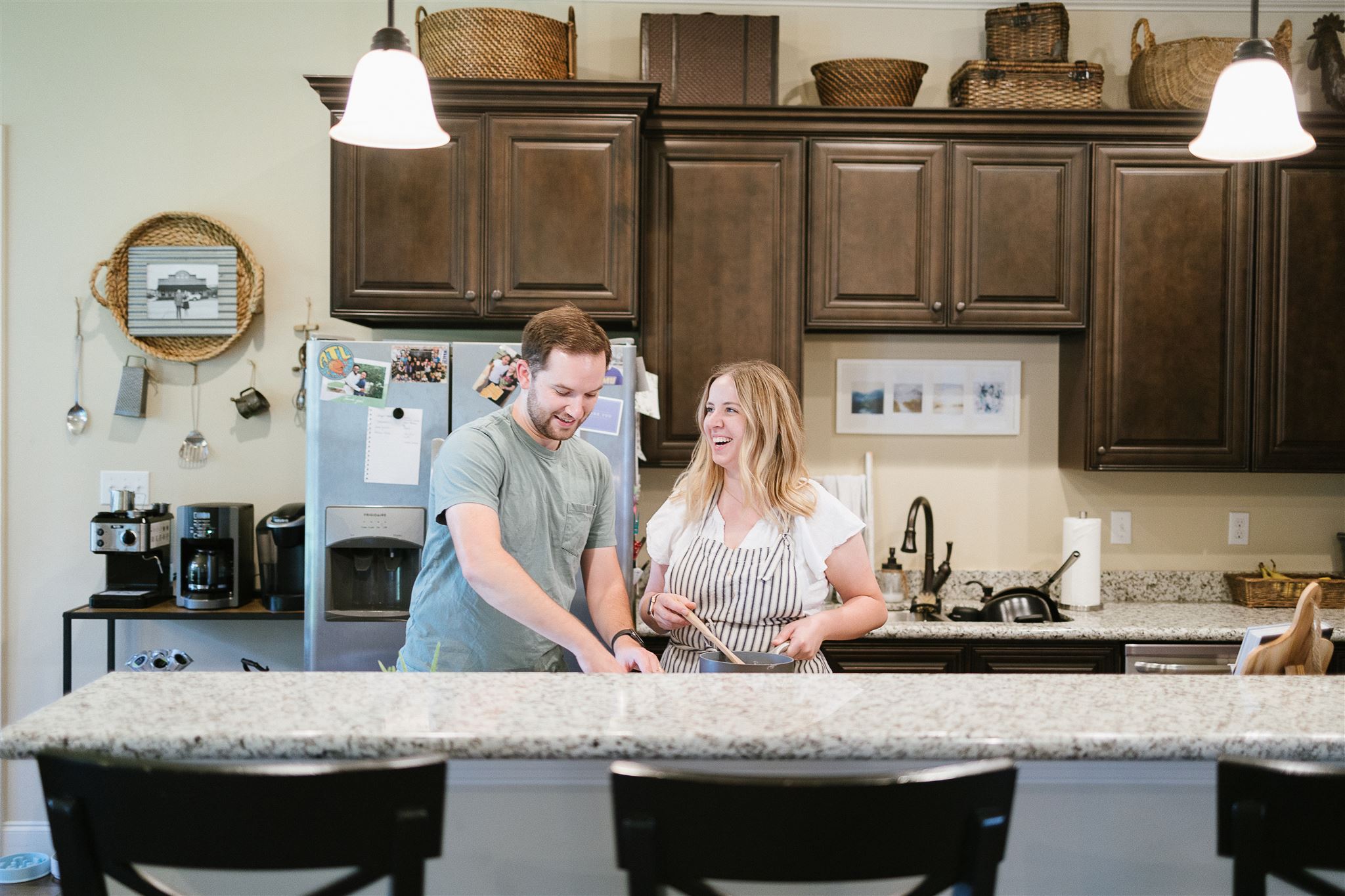 Emily Jones Lay and her husband working on baking in their kitchen in Louisiana.